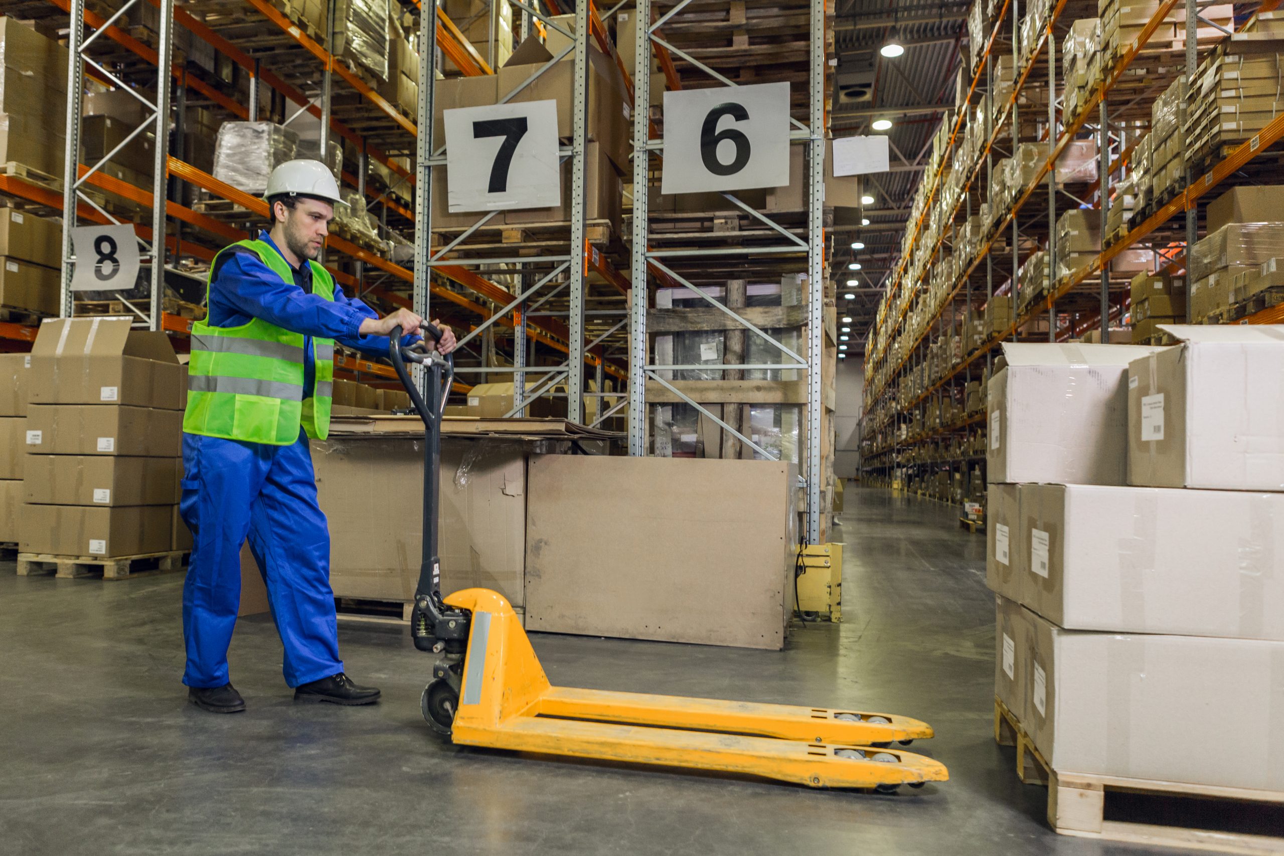 https://www.haulagecompanyliverpool.co.uk/wp-content/uploads/2025/11/worker-with-pallet-truck-posing-2021-10-07-16-45-59-utc-scaled-1.jpg